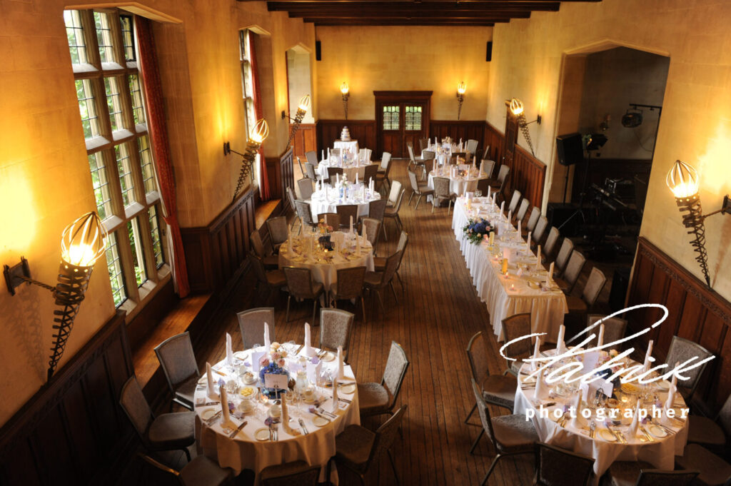 great hall, fanhams, wedding breakfast, candelit, soft lighting, round tables, long table,