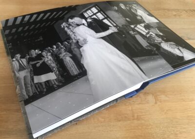 lay flat professional photo style printed photograph book, loxley, royal blue finish, black and white image, dancing, first dance, bride and groom