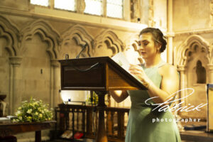 bidesmaid, reading, lectern, st albans abbey, green dress, interior cathedral
