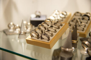 over the counter wedding rings displayed in box on angle amongst other rings
