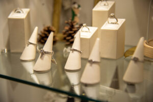 engagement ring displayed on cones on glass