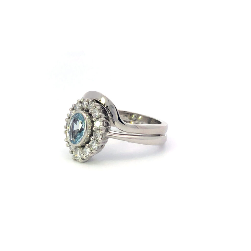 Cluster halo oval blue topaz rubover shaped wedding ring claw
