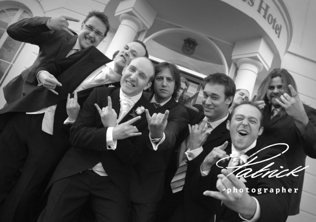 manor of groves hotel doorway, black and white, groomsmen pose, attitude