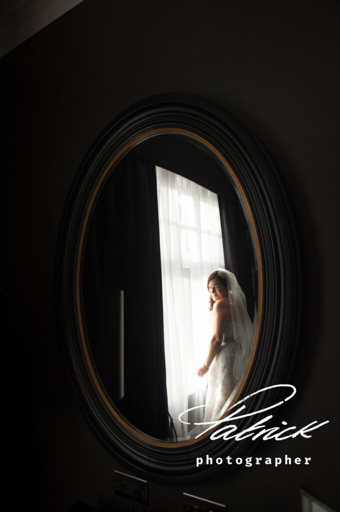 bride at window taken in mirror reflection