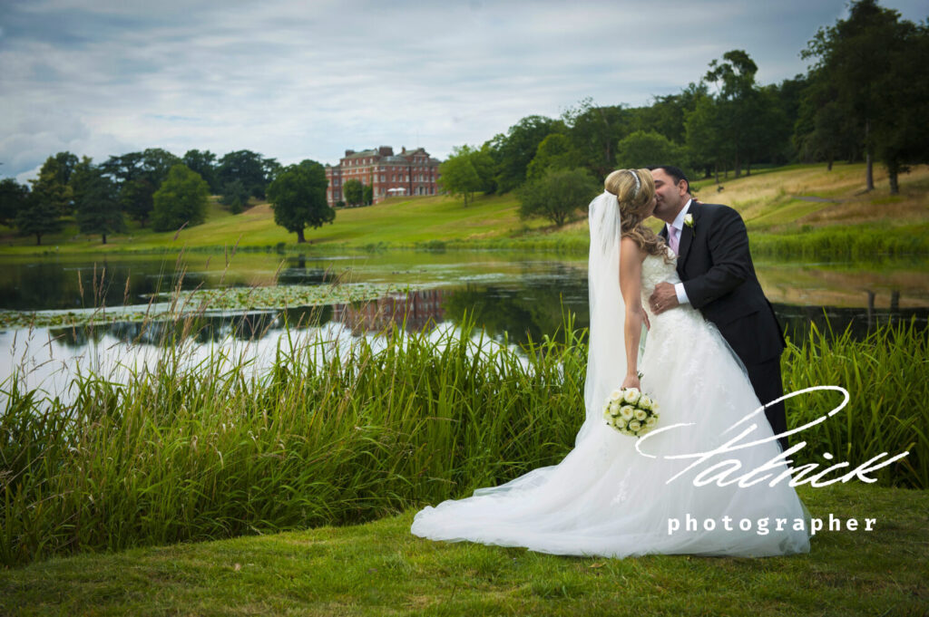 bride groom lake brocket Hall, trees, sky, bouquet, kiss, embrace