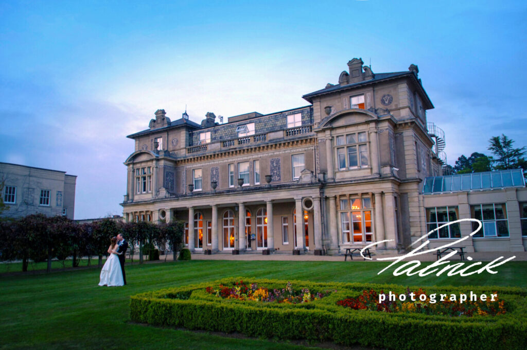 down hall dusk, bride and groom, gardens