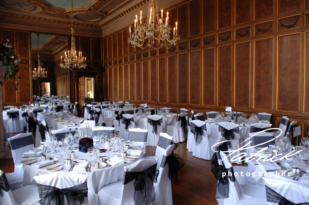 Grand Ballroom and Queen Charlotte’s Oak Panelled Gallery. tables dressed for wedding breakfast, showing off the grandeur of the room