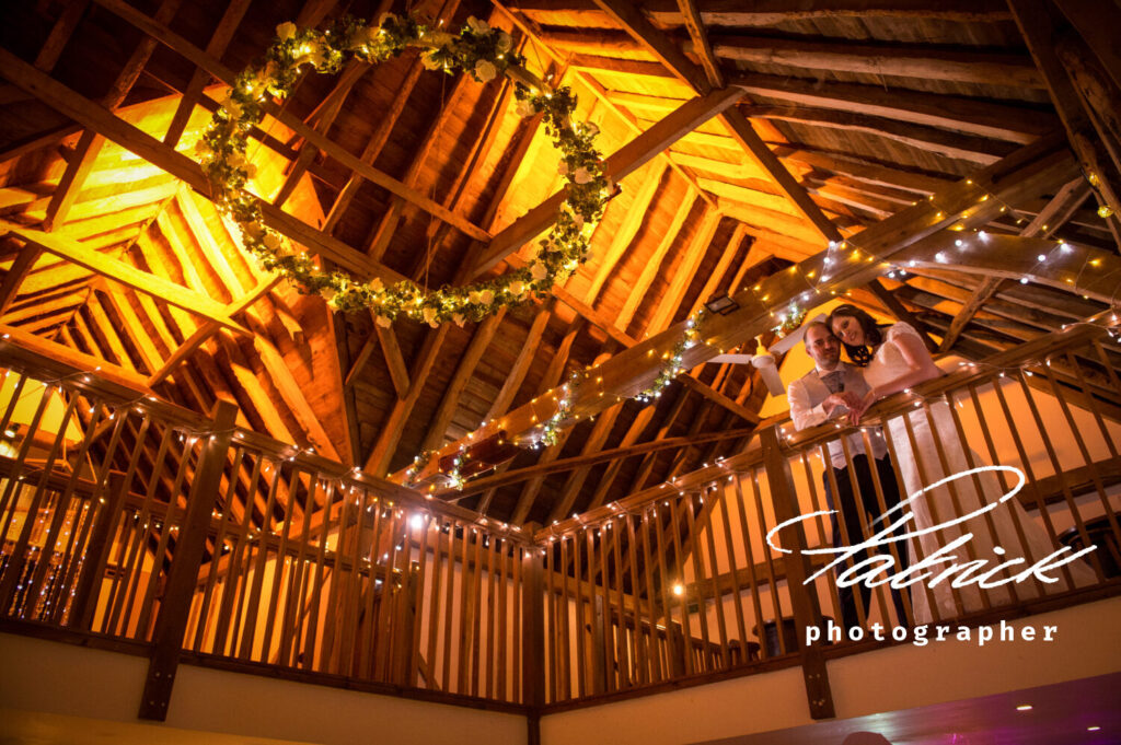 maiden's barn, ami and Phil, interior of barn, bride and groom elevated